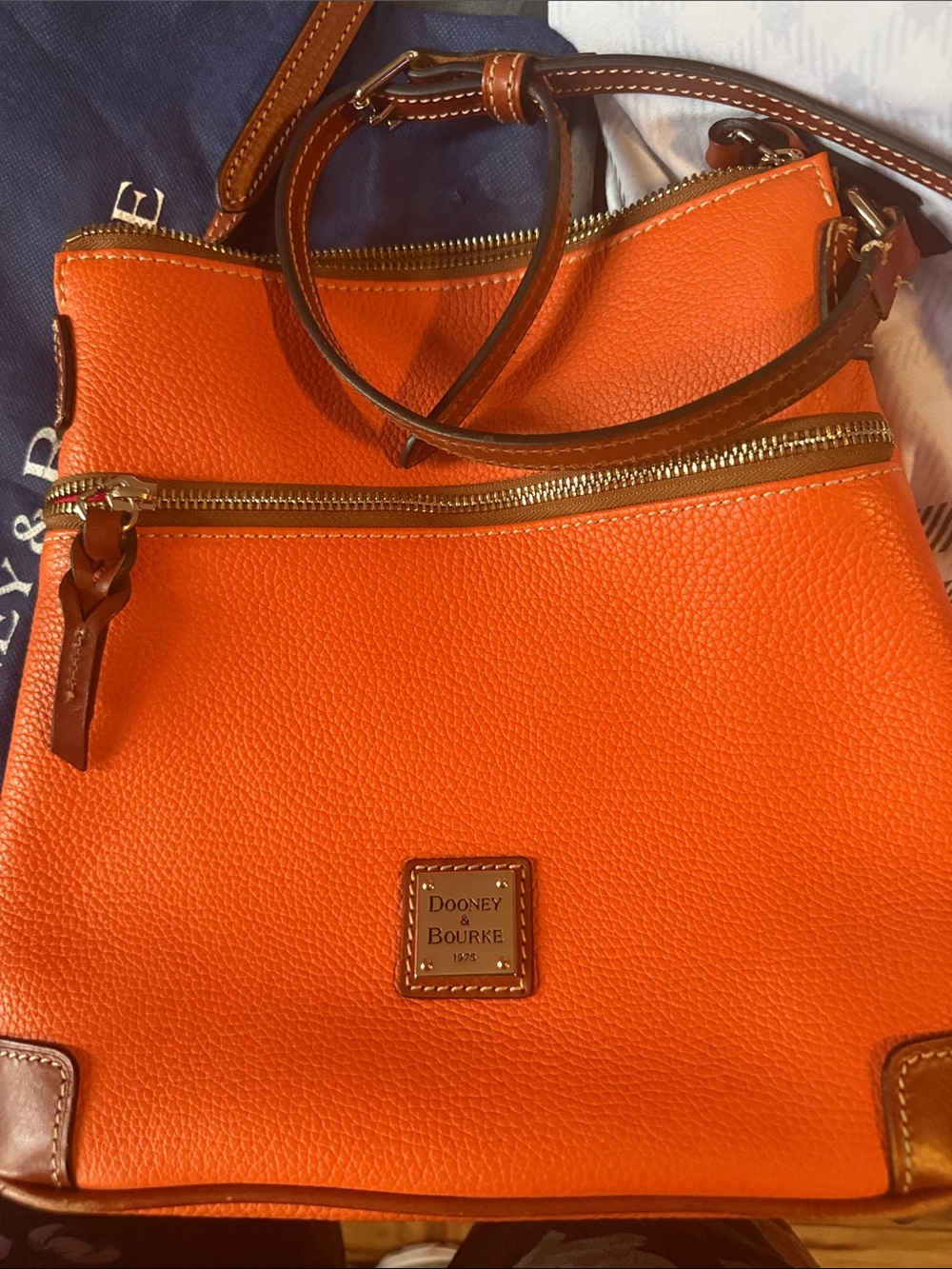 Dooney & Bourke Bright Orange Pebble Leather Crossbody with Brown Trim